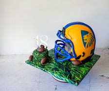 NFL helmet cake with blue and yellow with chocolate footballs for a male's 18th birthday Sydney cakes Sutherland shire cakes gluten free cake