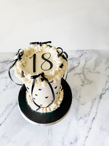 black and white ribbon cake with mini black hearts for a woman's 18th birthday Sydney cakes Sutherland shire cakes gluten free cake
