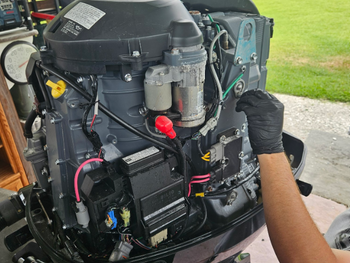 Outboard Engine getting it's scheduled maintenance to prevent costly repairs