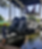 Professional outboard motor repair being performed dockside