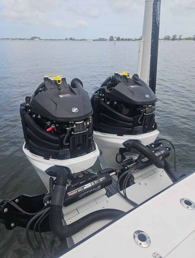 Twin outboard engines professionally installed and rigged on a center console boat in Florida.