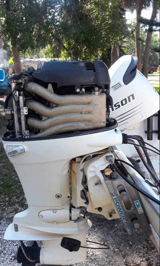 Technician diagnosing Johnson outboard starting problem