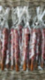 A DOZEN CARAMEL WRAPPED, CHOCOLATE DIPPED PRETZELS