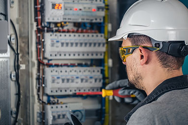 man-an-electrical-technician-working-in-a-switchboard-with-fuses (1)_Easy-Resize.com.jpg