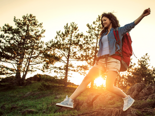 woman hiking in sunset