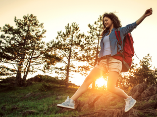 woman hiking in sunset