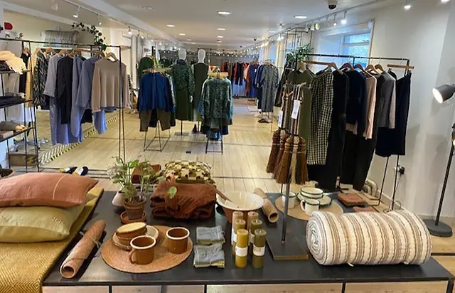 Boutique clothing store interior with fashion displays and accessories