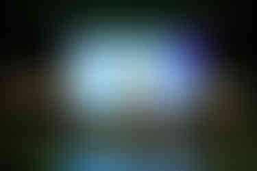 Zhisheng Wang singing during a musical rehearsal.