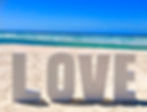 LOVE sign on the beach