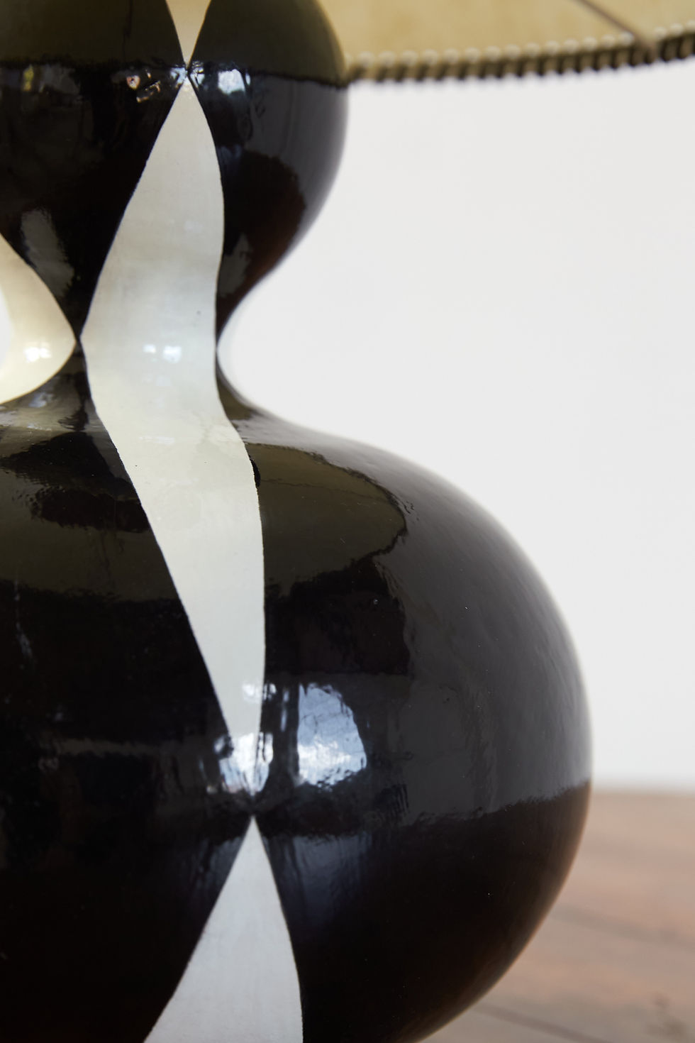 A sculptural table lamp from British ceramic artist Victoria Fowle, who creates her works using a technique of rolling and st