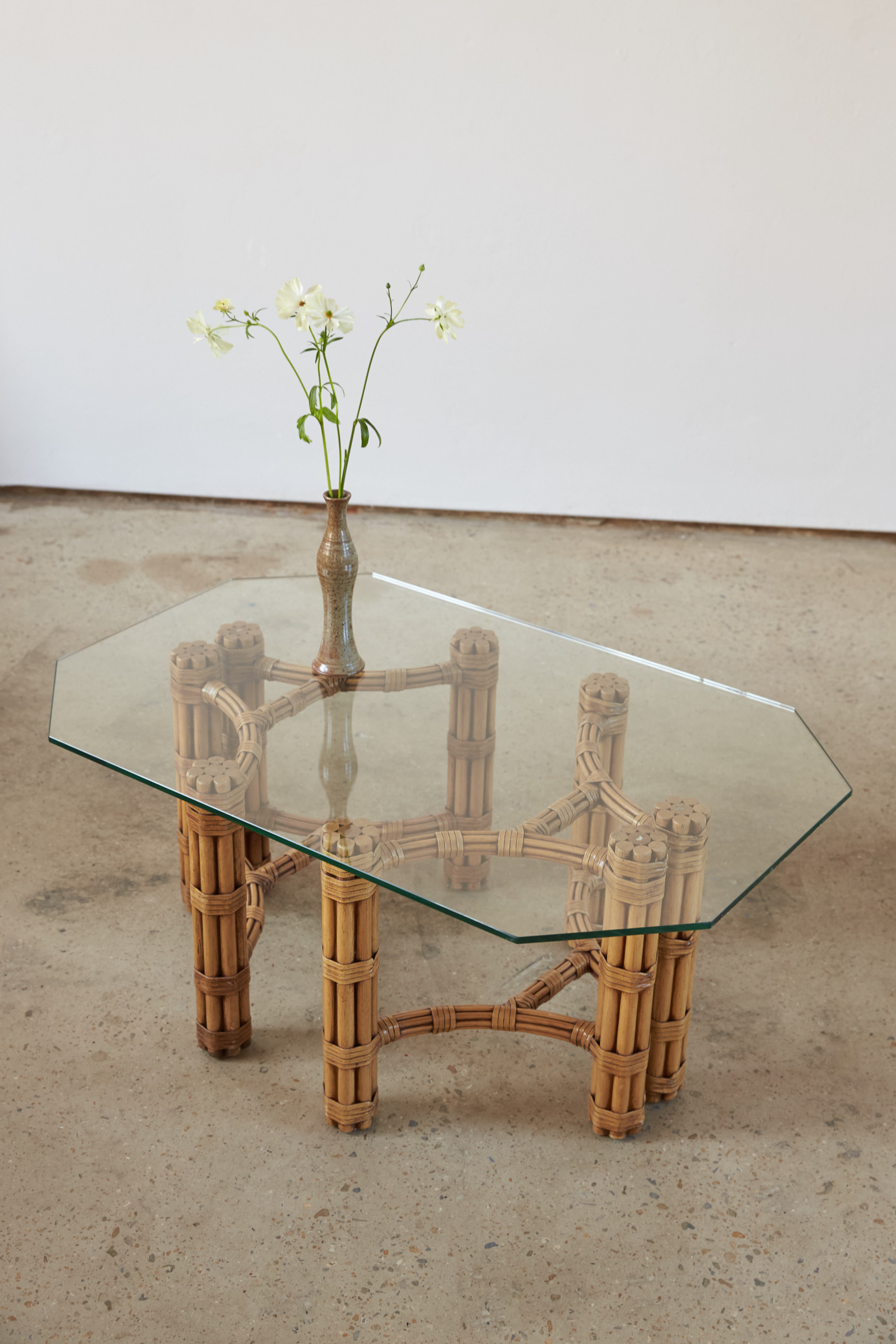 A geometric cane and glass coffee table by the renowned American company Maguire, C1970.