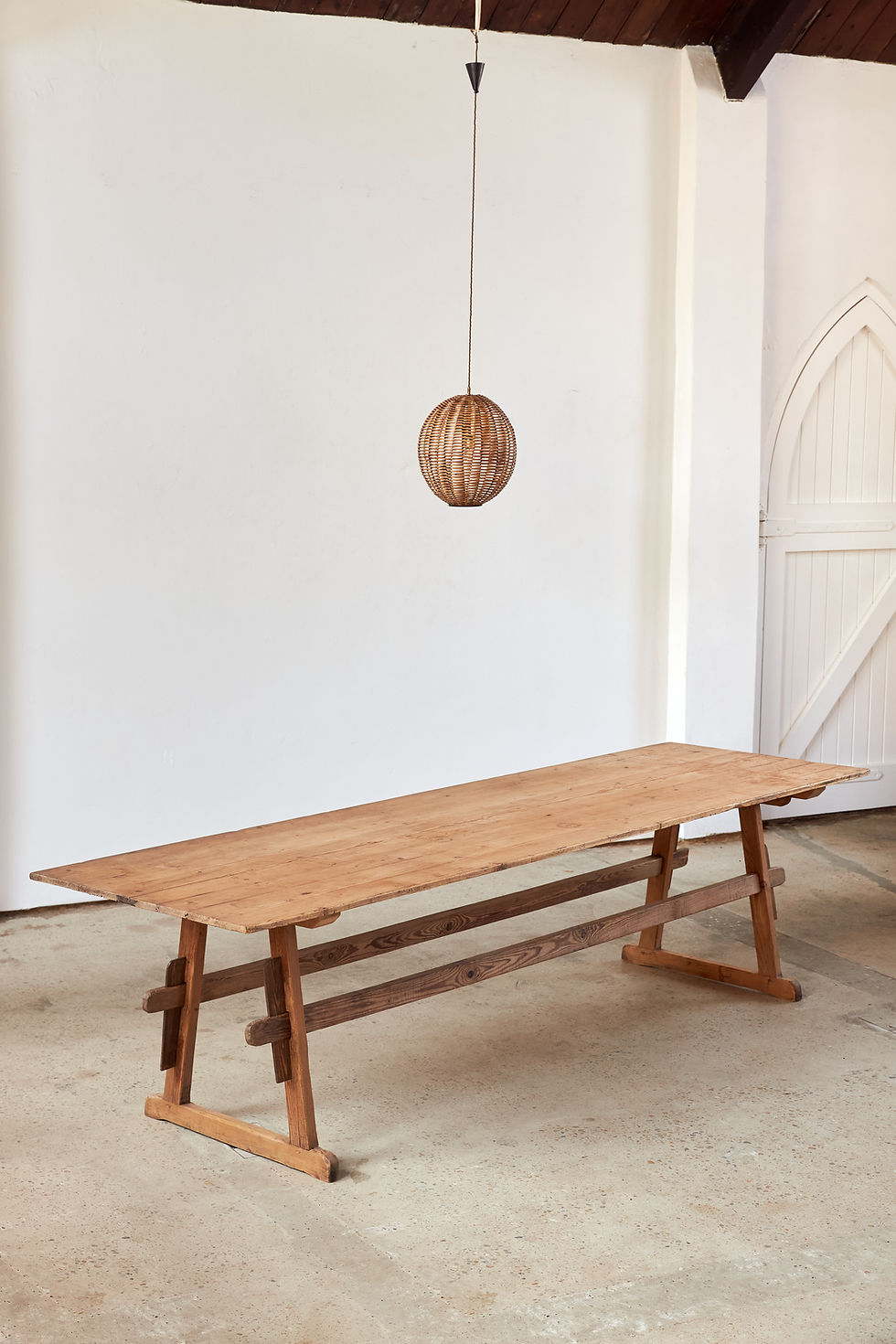 Thumbnail: A large-scale 19th-century pine trestle table from the Southern Tyrol, with two matching benches.