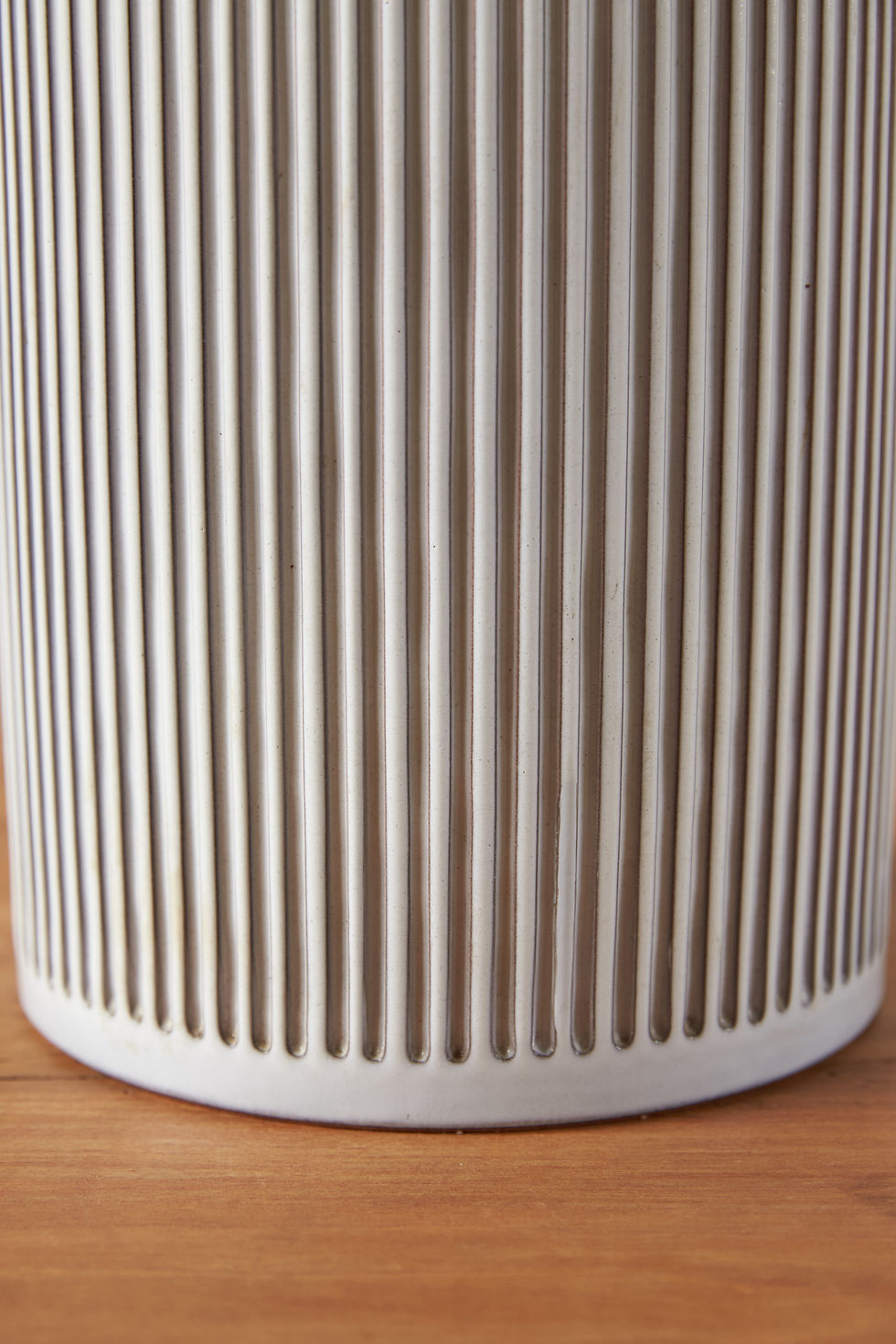Thumbnail: pair of generously sized chalk-white Swiss ceramic table lamps from the 1960s with a ribbed white glazed base and brass fini
