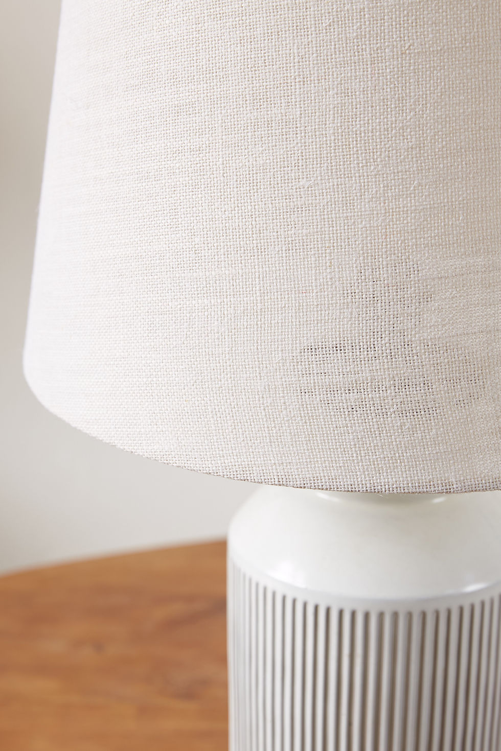 Thumbnail: pair of generously sized chalk-white Swiss ceramic table lamps from the 1960s with a ribbed white glazed base and brass fini