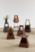 A unique collection of vintage Japanese street vendor stools, each handcrafted in wood and entirely individual in character,