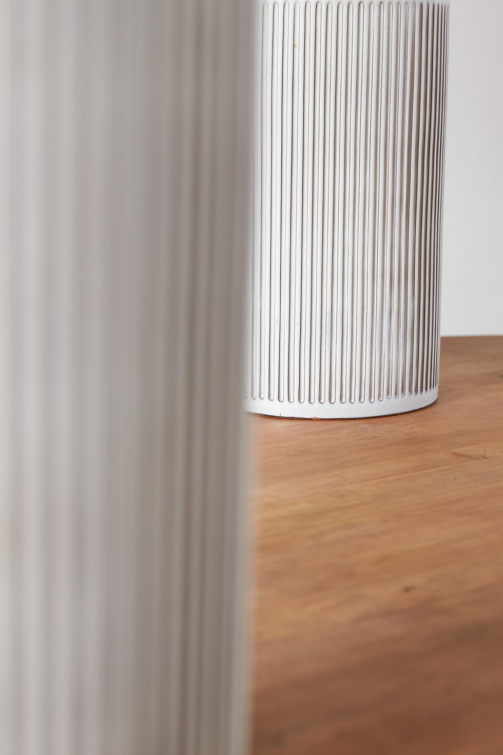 Thumbnail: pair of generously sized chalk-white Swiss ceramic table lamps from the 1960s with a ribbed white glazed base and brass fini