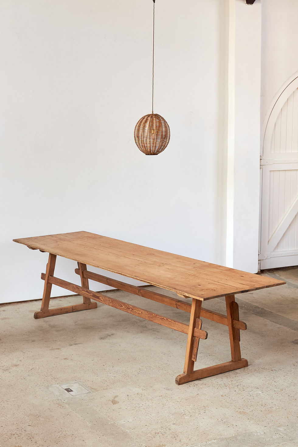 Thumbnail: A large-scale 19th-century pine trestle table from the Southern Tyrol, with two matching benches.