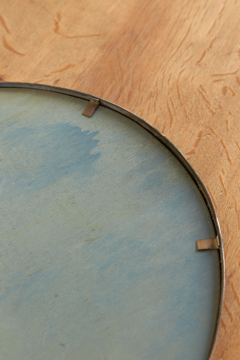 Thumbnail: A pair of Italian oval wall mirrors with original mirror plates set within nickel-plated brass frames. The slim frames are fi
