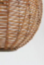 A mid-century Italian pendant light with a finely woven cane shade and brass fittings.