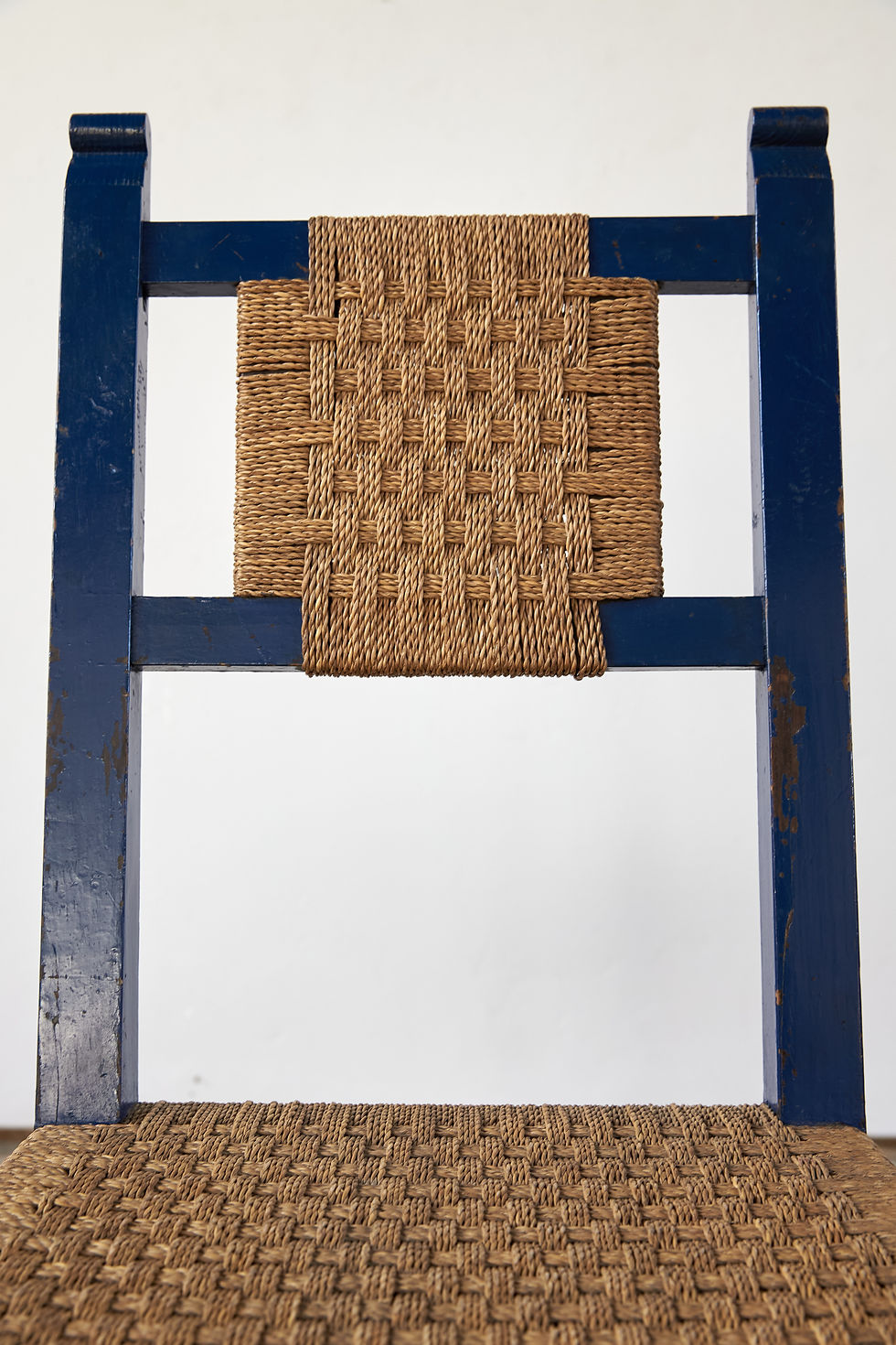 Thumbnail: A set of 4 mid-20th-century Spanish chairs with their historic, deep blue painted surface and woven cord seats.