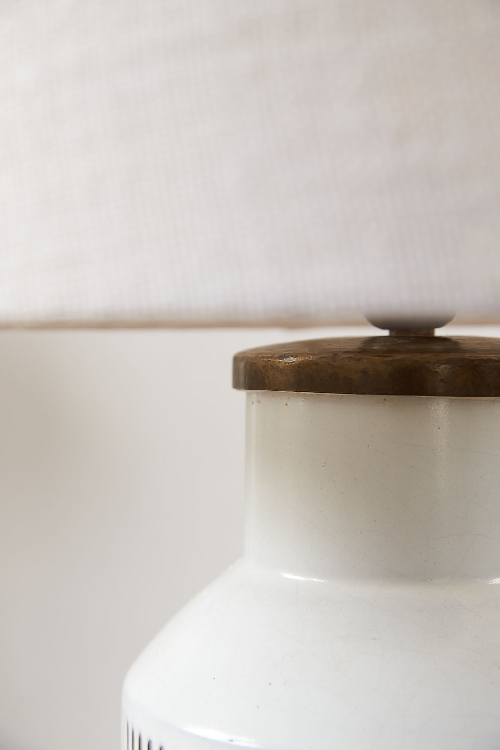 Thumbnail: pair of generously sized chalk-white Swiss ceramic table lamps from the 1960s with a ribbed white glazed base and brass fini