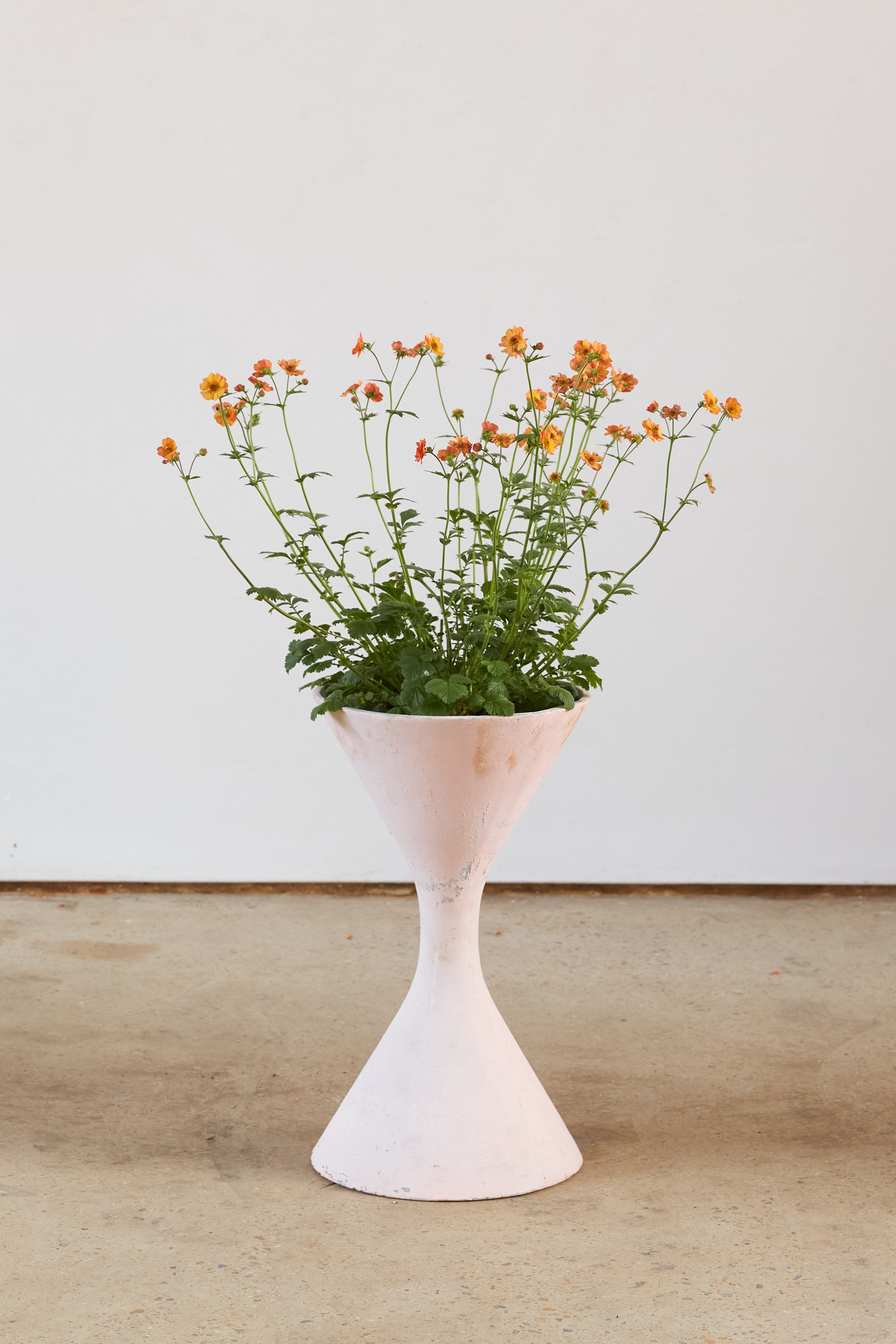 An original Willy Guhl for Eternit 'Diablo' planters, Switzerland, C1969, with a historical soft-pink painted surface