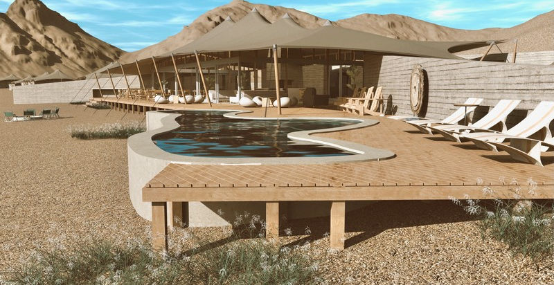 Guest Area wit deck and swimming pool and chairs on the desert sand at Hoanib Elephant Camp in The Skeleton Coast, Namibia