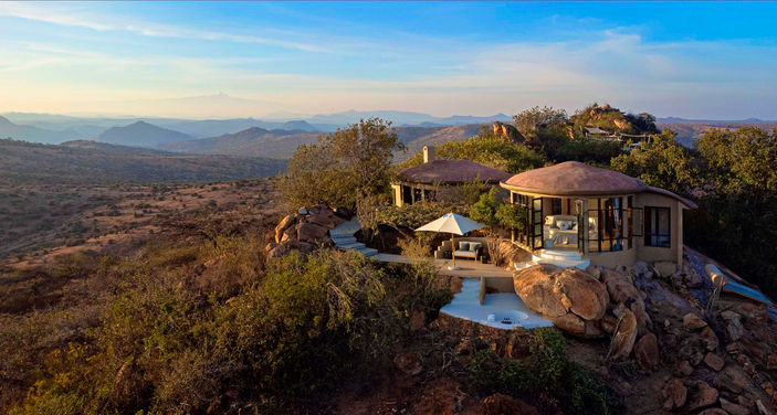 Two villas at Ol Lentille Lodge perched on top of a hill surrounded by the African bush