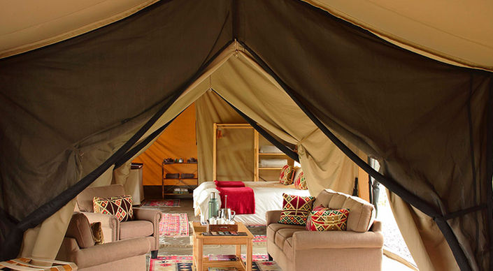 Luxury Safari Tent with bed and sitting area at Ol Pejeta Bush Camp in Laikipia in Kenya with Safari Ambitions
