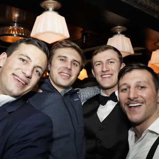 a group of friends at a themed party smile photographer by NYC photographer Askao Imamura, for hire for events and parties