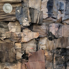 33"x33" collage by Anne Sutherlin made from black dyed cardboard