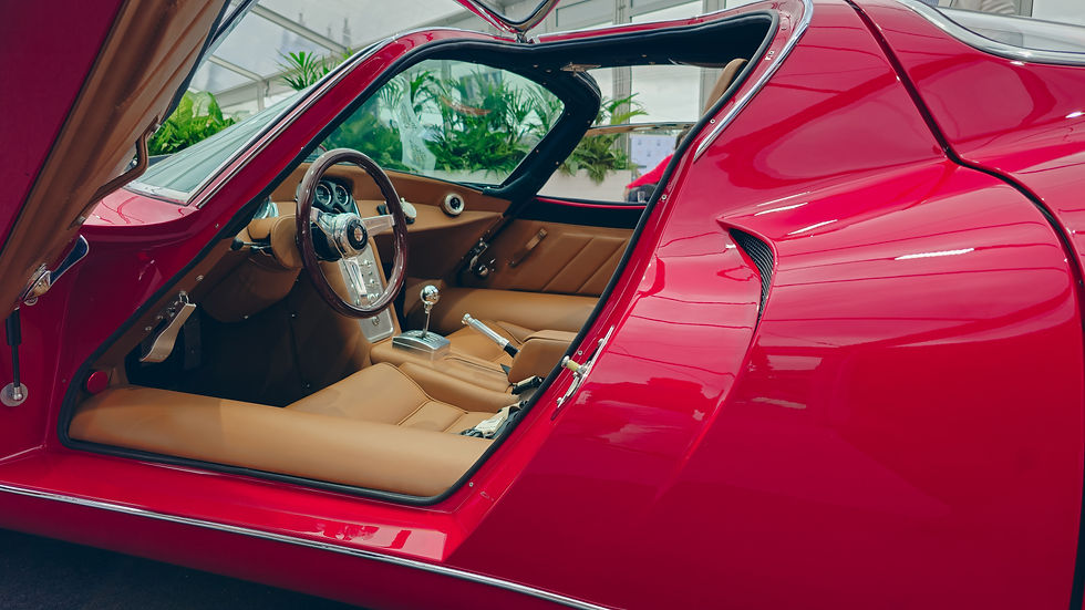 PPW R33 luxury car displayed at Salon Privé event with open door showcasing the interior design