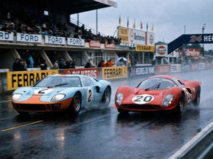Ford GT40 racing Ferrari head to head at Le Mans in wet, rainy conditions