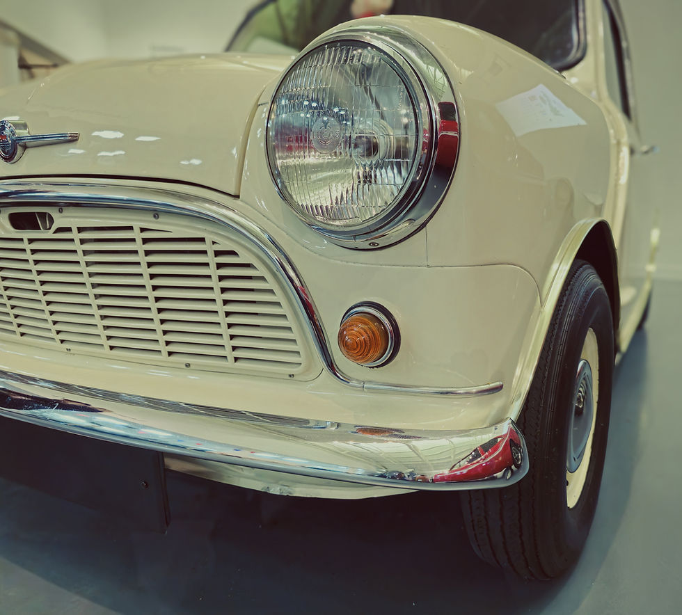 Front side view of a classic Austin Mini, showcasing its iconic compact design