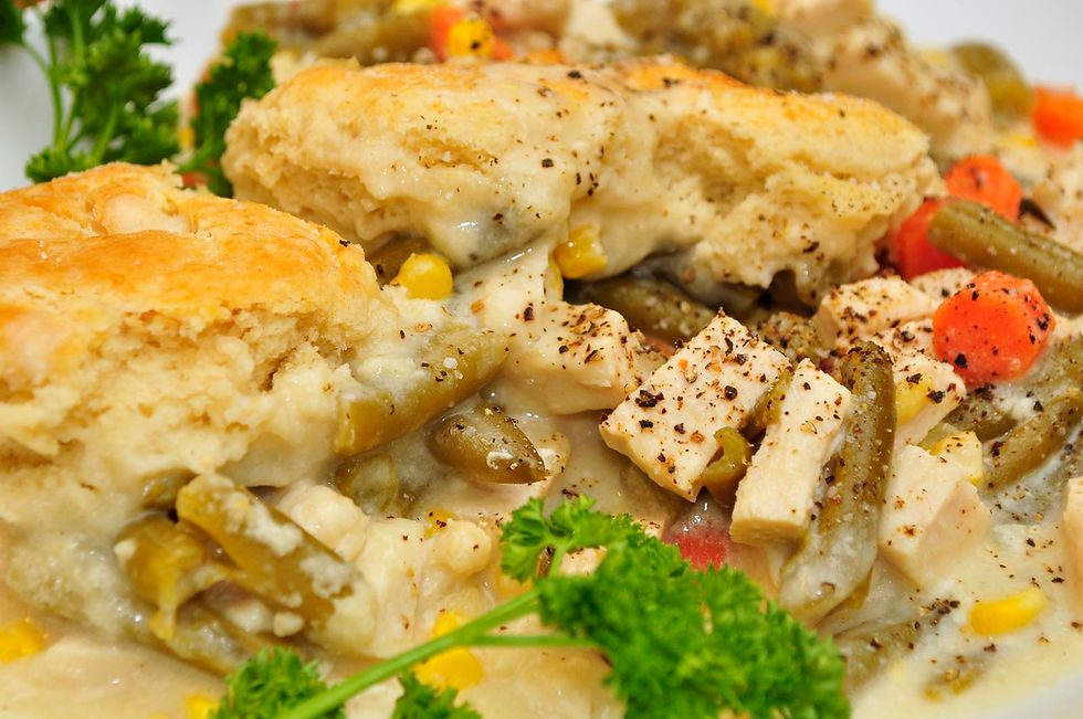 Golden biscuits over creamy chicken and mixed vegetables.