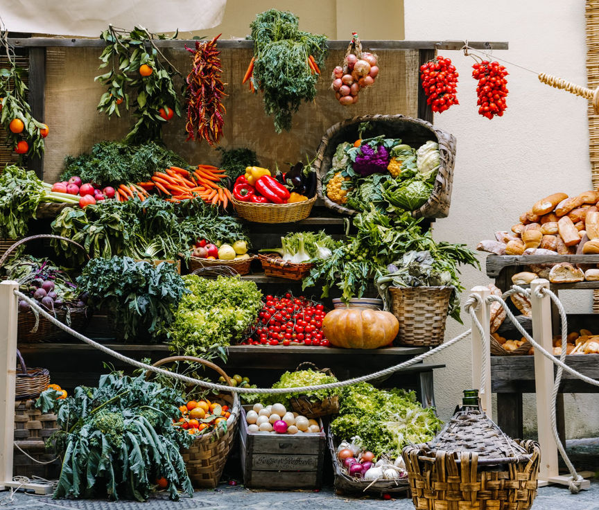 Colorful vegetables arranged at a produce stand; representative market photograph.