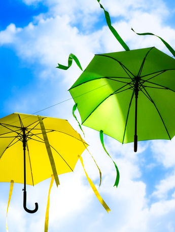 Yellow & Green Umbrellas Dancing In The Wind