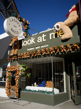 Look at Me Lashes and Nails salon storefront in San Francisco decorated with teddy bears