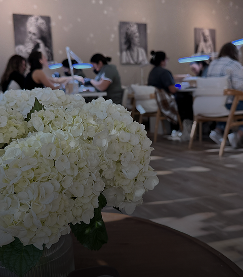 Busy nail salon promotion with hydrangeas in foreground
