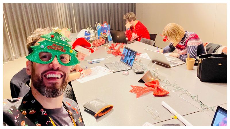 erik collard linkedin team Christmas celebration with Secret Santa gifts and decorations