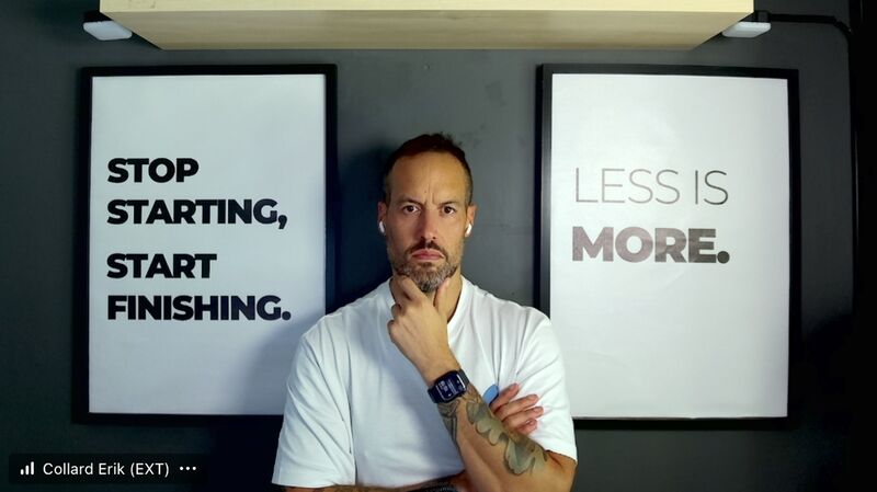 erik collard linkedin home office desk setup with motivational quotes on wall