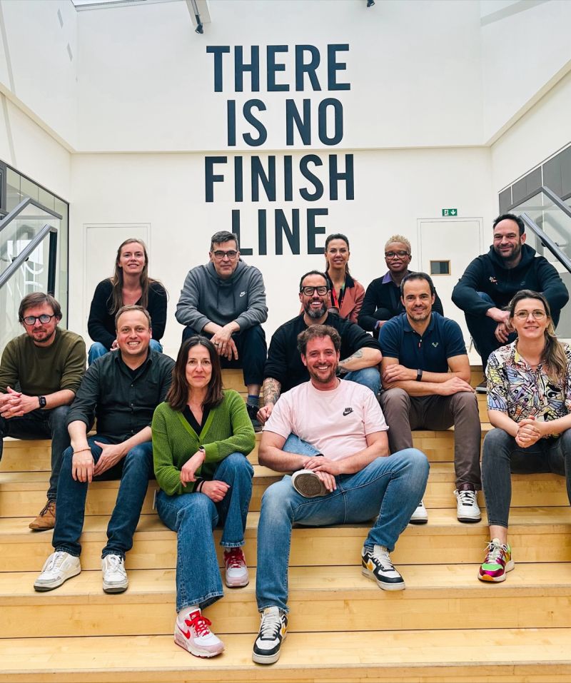 erik collard linkedin Nike staircase with 'There is no finish line' motivational text