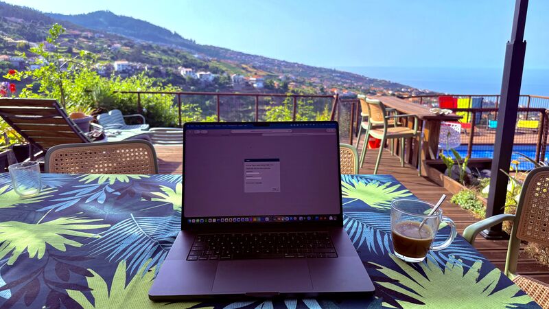 erik collard linkedin Freelancer working on laptop with coffee, illustrating work-life balance