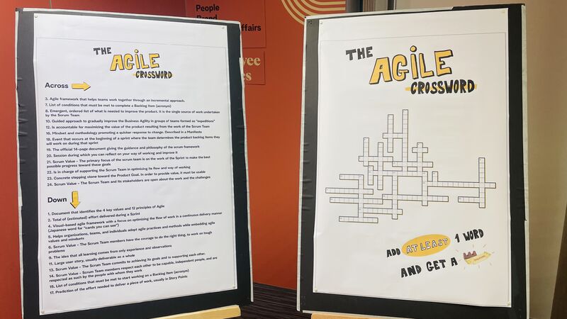 erik collard linkedin Agile CoE booth with large printed Agile Crossword puzzle featuring Scrum values and agile principles at internal GROW Village fair