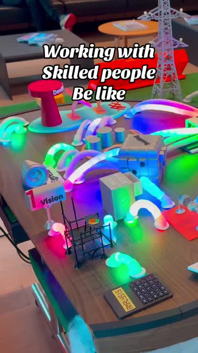 erik collard linkedin Elia Group team displaying colorful IoT platform mockup at Innovation Fair presentation