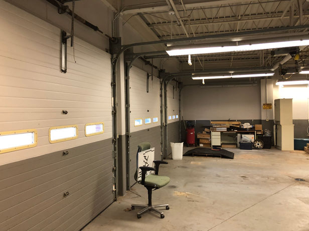 Commercial Space Garage Bays Prior to Conversion to Food Prep Area - Daniel Builders