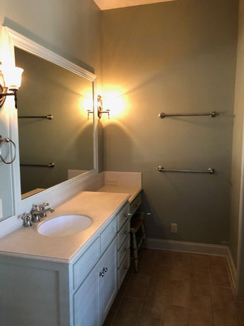 Bathroom Vanity and Dated Green Walls Prior to Bathroom Remodel - Daniel Builders
