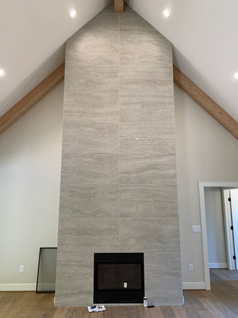 Large Tile Surrounding Finished Fire Place in Great Room - Daniel Builders