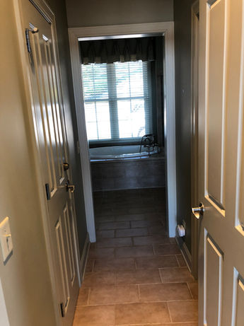 Open Entry Door to Master Bathroom Prior to Renovation - Daniel Builders  