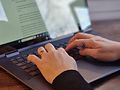 Hands typing on a laptop - Crescent Digital Marketing